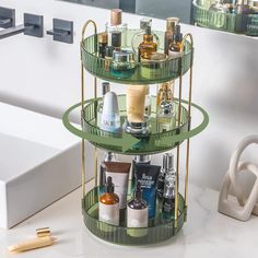 a three tiered shelf with bottles and cosmetics on it in front of a mirror