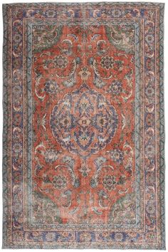 an orange and blue rug with ornate designs