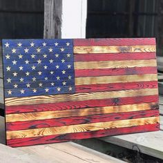 an american flag painted on wooden planks