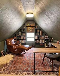 a room with a desk, chair and bookshelf in the middle of it