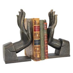 a bookend with two books on it and one holding the other's hands