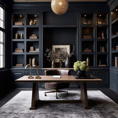 an office with dark blue walls and leather chairs in front of a large bookcase