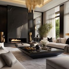 a modern living room with white couches and black tables in front of a fireplace