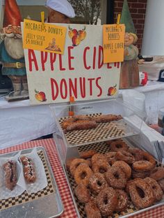 there are many donuts on display at the table for people to enjoy them and eat them