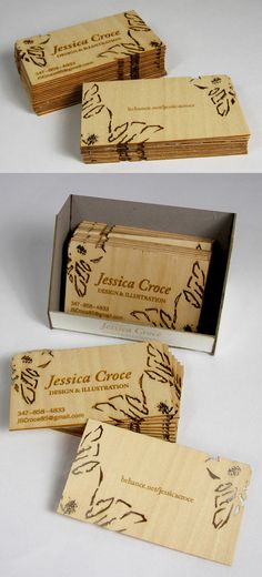 three wooden business cards in a box