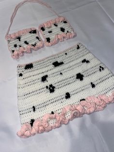 a crocheted purse and matching handbag on a white sheet