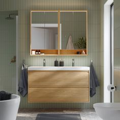 a bathroom with a sink, mirror and bathtub