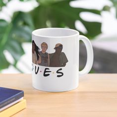 a white coffee mug with an image of two people and the words yes on it