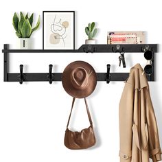 a hat, coat rack and purse hanging on a wall