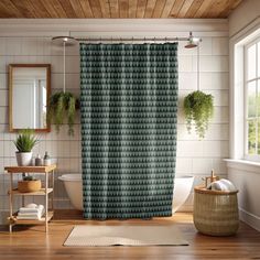 a bathroom with a shower curtain and rug