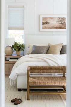 an open door leading to a bedroom with white walls