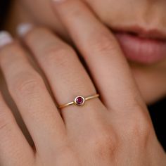 Ruby Ring 14K Gold Dainty Stacking Simple Red Stone Bezel Modern July Birthstone GR00218 A modern and timeless 14K gold ring with a natural Ruby gemstone. A perfect gold ring for women, stacking and minimalist that adds glam to every outfit. 100% handcrafted with love! ● Metal: 14K solid gold ● Gemstone: Natural Ruby ● Stone Diameter: 3.3mm R I N G ∙ S I Z I N G For General Reference: ● we use standard US Ring Sizing ● an average women's ring finger is size 6-7 ● each ring is custom made upon or Ruby Dainty Ring, Elegant Ruby Stackable Rings With Round Band, Elegant Ruby Ring With Bezel Setting, Elegant Yellow Gold Stackable Rings With Round Stone, Modern 14k Gold Red Rings, Elegant Yellow Gold Stackable Rings, Fine Jewelry Solitaire In Recycled Gold, Minimalist Jewelry With Bezel Setting For Anniversary, Minimalist Bezel Set Jewelry For Anniversary