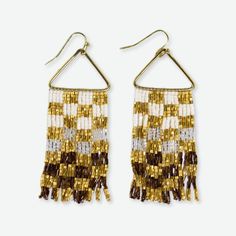 Make a bold statement with the Paige Ombre Checked Beaded Fringe Earrings in Mixed Metallic. These striking earrings feature a captivating combination of metallic seed beads arranged in a checked pattern, creating a stunning visual effect that seamlessly blends glamour and bohemian charm. The earrings showcase an ombre design, with the seed beads transitioning from light to dark shades of gold, bronze, and copper. This gradation of color adds depth and dimension to the piece, drawing the eye and Pickle Gifts, Gift Tags Birthday, Beaded Fringe Earrings, Ombre Design, Toddler Winter, Home Office Accessories, Best Candy, Shades Of Gold, Baby Shower Cards