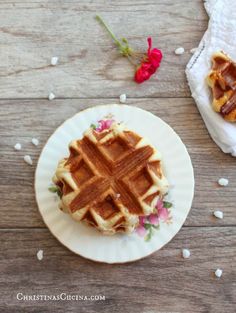 a waffle sitting on top of a white plate