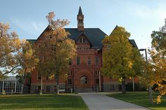 an old red brick building with a clock tower