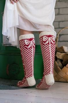 the legs of a woman wearing red and white socks