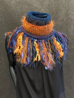 Handmade Knit Reversible Turtleneck Cowl with artsy fringe, Knit neckwarmer, round scarf, blue orange yellow cowl, hat, headband, hand spun fibers, cosplay, gypsy, bohoNew style! Be Styish. Be Warm. Wear one of a kind! This style has been very popular at in-person art fairs since 2018. **On person example in a different colorblend. Spice up your fall and winter wardrobe - in style! If you're not in to the long scarves and longer style pieces, but still want the unique fashion style of a shaggy, Aquarius Rising Aesthetic, Rising Aesthetic, Unique Fashion Style, Person Art, Aquarius Rising, Orange Knit, Hat Headband, Art Fairs, Handmade Knit