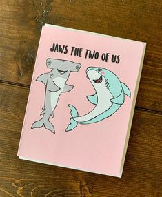 a card with two sharks on it and the words, jawss this two of us