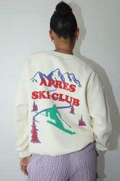 Stay warm and cozy while looking stylish in our Apres Ski Club Pullover Top Cream. This ski slope club cream pullover sweatshirt looks perfect on and off the slopes – its classic design is sure to turn heads! Soft and comfortable, this top is sure to be your favorite addition to your winter wardrobe. Get your Apres Ski Club Pullover Top Cream today and experience the best of off-slope fashion!