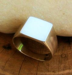 Men's signet sterling silver ring. plain design. classic ring for men with a modern finish. clean, simple, light, bright and very impressive unisex ring.It's usually worn on the  pinky finger but it is beautiful on any other finger.Perfect as a gift for your man.12 mm plateHere is the gold plated option:https://www.etsy.com/il-en/listing/575202172/signet-ring-ring-for-man-mens-signet?ref=shop_home_active_10&frs=1Here is a personalize version:https://www.etsy.com/il-en/listing/660798604/signe Cheap Classic Men's Signet Ring, Luxury Silver Signet Ring For Men, Minimalist Square Signet Ring Gift, Square Signet Ring Men, Silver Stainless Steel Signet Ring With Polished Finish, Hipster Rings, Mens Pinky Ring, Unique Silver Rings, Unisex Earrings