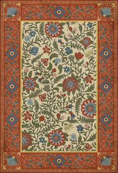 an intricately designed rug with flowers and leaves in red, blue, yellow and green