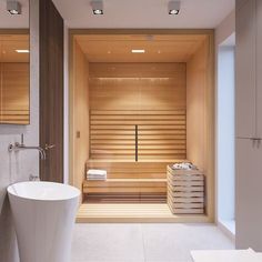 a bathroom with a large white tub next to a sink