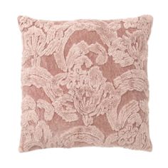 a pink pillow with an intricate lace design on the front and back, sitting on a white background