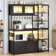 a kitchen with a microwave, coffee maker and other items on the shelves in front of it