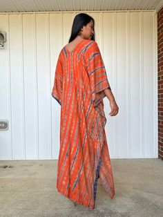 This kaftan, made from rayon fabric and hand dyed, is versatile for many occasions. It complements all body types with its long, hangs loose design and slits up both sides. It can be worn in many different stylish ways to make you look your best! DETAIL • All measurements are flat• Bust/ Waist/ Hips 34 in. (Circumference 68 in.)• Arms 11 in. (Circumference 22 in.)• Length 50 in. The model wear • V-Neck • Side slits• No pocket• Slipover style• All above measurement are flatFABRIC• 100% Rayon FIT• Long Batik Print Kaftan For Spring, Long Kaftan With Batik Print For Spring, Long Spring Kaftan With Batik Print, Hand Dyed Flowy Kaftan For Vacation, Bohemian Rayon Kaftan For Beach, Long Kaftan With Natural Dye For Festivals, Flowy Long Tunic For Festival, Maxi Length Kaftan With Natural Dye For Beach, Bohemian Flowy Dress With Side Slits