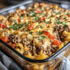 a casserole dish with meat, cheese and vegetables