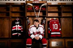 High School Senior Boy in in school jersey sitting in Hockey lockeroom. St Charles, Bexley Ohio Hockey Player Hockey Goalie Senior Pictures, Hockey Senior Pics, Hockey Poses Photo Ideas, Goalie Senior Pictures Hockey, Senior Pictures Hockey Photo Ideas, Outdoor Hockey Pictures, Hockey Locker Room Senior Pictures