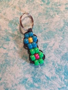 a keychain made out of colorful beads