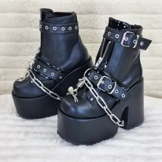 5" (127mm) Chunky Heel, 3" (75mm) Platform Ankle Boots Metal Front Zip Closure Top Buckle Strap W/ Eyelet & Lower Buckle Strap W/ Eyelets, D-Ring & Working Removeable Chrome Metal Plated Padlock With Keys Removeable Thick Metal Chain Draped Through Platform And Heel Channel Brand New Demonia Us Sizes 6-12 Chunky Goth Boots, Gothic Platform Boots With Metal Feet For Party, Silver Gothic Boots With Metal Feet, Gothic Silver Boots With Metal Feet, Silver Platform Punk Boots, Edgy Silver Platform Boots, Halloween Party Platform Boots With Metal Feet, Gothic Silver Boots With Round Toe, Aj Shoes