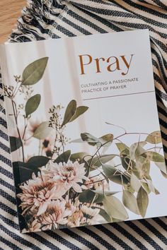 the book pray culting a passionate service of prayer is on a striped tablecloth