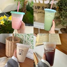 two people holding up cups with straws and books on the table in front of them