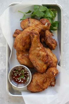 chicken wings with dipping sauce on the side