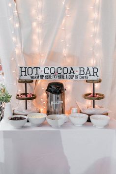 there is a hot cocoa bar set up on the table