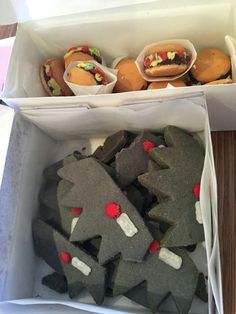 a box filled with different types of cookies and pastries on top of a table