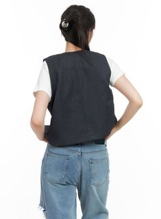 Product Detail Style : Street, Acubi Occasion : Back to school Detail : Buttoned Print : Solid Material : Polyester Sleeve : Sleeveless Neck : V neck Polyester100 Color : Black Made in Korea Model Size Model is wearing size S/M and the color Black. Height : 5'7" | 171cm / Top : XS / Bottom : S (25 inch) .prddescription table, .prddescription td, .prddescription th { border : 1px solid black; border-collapse : collapse; padding: 10px; } Size(Inch) Size Shoulder Bust Armhole Hem Total Length S/M 1 Black Casual Denim Vest For Summer, Casual Sleeveless School Vest, Casual Denim Vest For Winter Workwear, Casual Winter Denim Vest For Work, Casual Winter Workwear Denim Vest, Black Sleeveless School Top, Fitted Casual Denim Vest With V-neck, Casual Black Sleeveless Denim Vest, Black Sleeveless Denim Vest