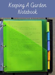 an open notebook with the words keeping a garden notebook written on it