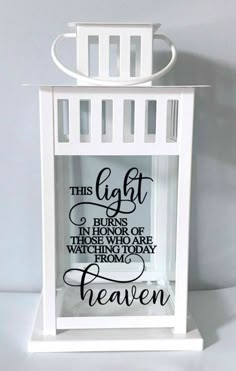 a white lantern with a quote on it