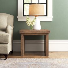 a living room scene with focus on the end table and chair, which has a lamp on it