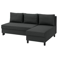 a black couch with three pillows on it's back and one arm facing the other