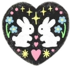 two rabbits in the shape of a heart with stars and flowers on it's sides