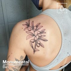 a woman with a tattoo on her back