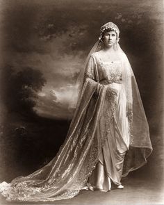 an old photo of a woman in a wedding dress