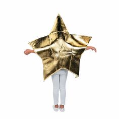 a woman is standing with her arms spread out to show the shape of a gold star