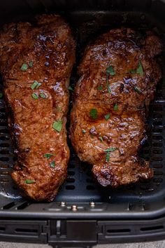 two pieces of meat sitting in a black basket