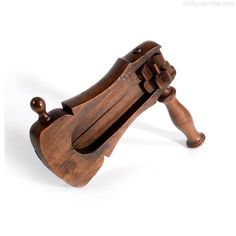 an old wooden instrument on a white background