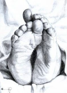 a pencil drawing of a foot with three balls on it